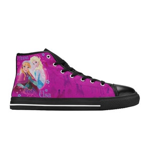 May include: Pink high-top canvas shoes with a black sole. The shoes feature a design of the characters Anna and Elsa from the movie Frozen. The design includes the text "Anna" and "Elsa" on the shoes.