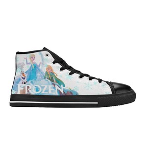 May include: Black high-top canvas shoes with a white background featuring a print of the characters from the movie Frozen. The print includes Elsa, Anna, and Olaf. The word "FROZEN" is printed in large letters on the shoe.