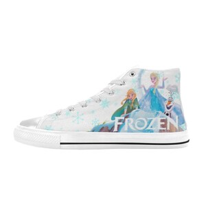 May include: White high-top canvas shoes with a print of the characters from the movie Frozen. The print features Elsa, Anna, and Olaf standing on a snowy mountain. The word "FROZEN" is printed in large letters on the side of the shoe.