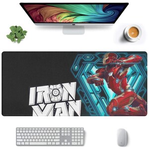 May include: A black and blue mousepad with a white graphic of Iron Man and the text "IRON MAN".