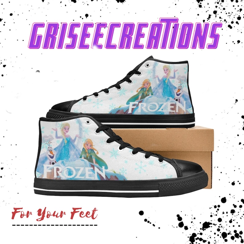 May include: Black high-top canvas shoes with a white background featuring a scene from the movie Frozen. The scene includes Elsa, Anna, and Olaf. The shoes have black laces and a black sole. The words "Frozen" are printed on the shoes.
