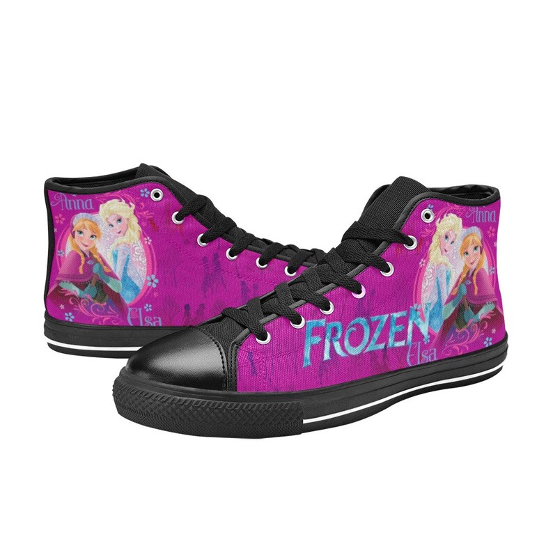 May include: Black high-top canvas shoes with a pink background featuring a graphic of Elsa and Anna from the movie Frozen. The text "FROZEN" is printed in blue on the shoes.