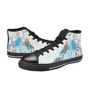 May include: Black high-top canvas shoes with a white background featuring a snowflake pattern and a graphic of the characters from the movie Frozen. The text "Frozen" is printed on the shoes.