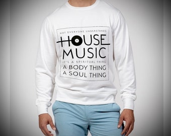 May include: White long-sleeve sweatshirt with black text that reads "NOT EVERYONE UNDERSTANDS HOUSE MUSIC IT'S A SPIRITUAL THING A BODY THING A SOUL THING". The text is centered on the sweatshirt and includes a black vinyl record graphic.