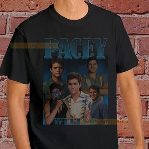 May include: Black t-shirt featuring a vintage-style graphic of the character "Pacey" from the TV show "Dawson's Creek". The graphic includes multiple images of the character in different poses.