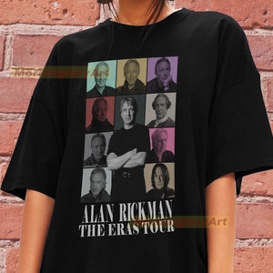 May include: Black t-shirt featuring a collage of images of Alan Rickman in various roles. The text "Alan Rickman The Eras Tour" is printed beneath the images.
