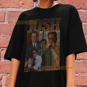 May include: Black t-shirt with a vintage-style graphic of four men with the word "JOSH" printed above them.