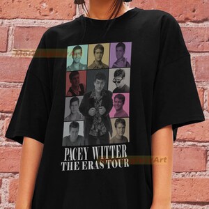 May include: Black t-shirt featuring a collage of photos of a man with the text "Pacey Witter The Eras Tour" printed on the front.