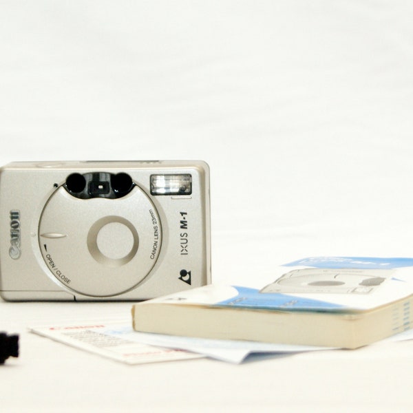 Canon IXUS M-1 vintage APS film camera in excellent condition with it manual instruction.