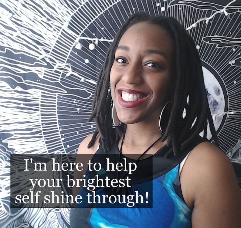 May include: A woman with long dreadlocks smiles at the camera. She is wearing a blue and white patterned tank top and a necklace with a pendant. The background is a black and white tapestry with a circular design. The text "I'm here to help your brightest self shine through!" is superimposed on the image.