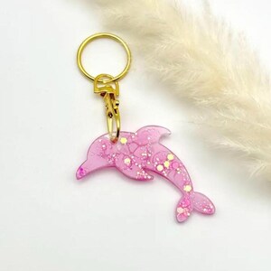 Porte-clés dauphin rose pailleté