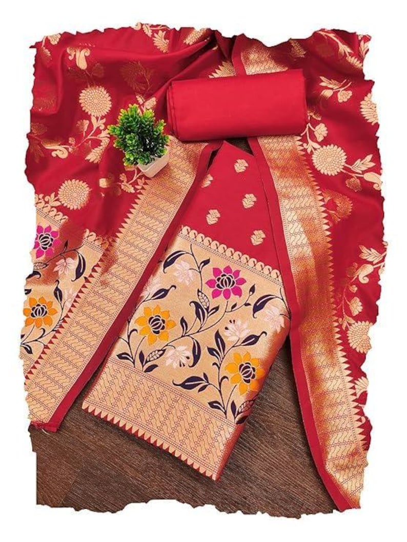 May include: A red fabric set featuring a large piece of cloth with gold floral patterns and a smaller solid red rectangular piece. The fabric displays intricate gold woven designs of flowers and leaves, with a wide border featuring yellow and pink floral motifs.