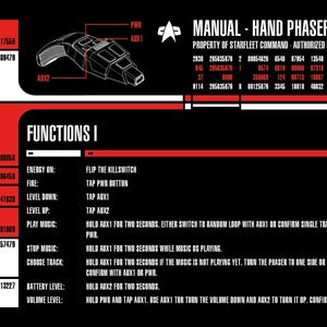 May include: A black and red manual for a Hand Phaser Type 2, with a diagram of the phaser and instructions for its functions. The text includes energy, fire, level, music, and battery level controls.