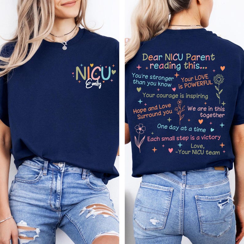 May include: A navy blue t-shirt with a colorful "NICU Emily" graphic on the front and an encouraging message for NICU parents on the back. The message includes phrases like "Your love is powerful" and "We are in this together".