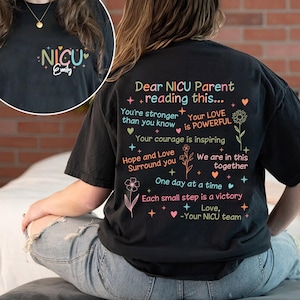 May include: Black t-shirt with a message of encouragement for NICU parents. The text reads "Dear NICU Parent + reading this... You're stronger than you know Your LOVE is POWERFUL Your courage is inspiring Hope and Love Surround you We are in this together One day at a time Each small step is a victory + Love, -Your NICU team".