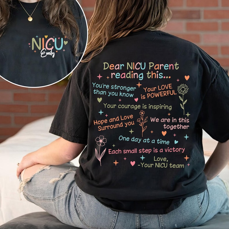 May include: Black t-shirt with a message of encouragement for NICU parents. The text reads "Dear NICU Parent + reading this... You're stronger than you know Your LOVE is POWERFUL Your courage is inspiring Hope and Love Surround you We are in this together One day at a time Each small step is a victory + Love, -Your NICU team".
