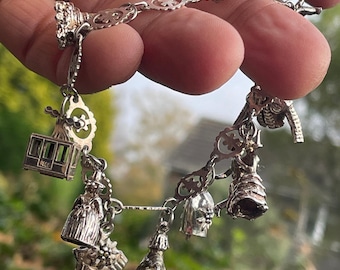 Charm bracelet some marked 800 silver 26g