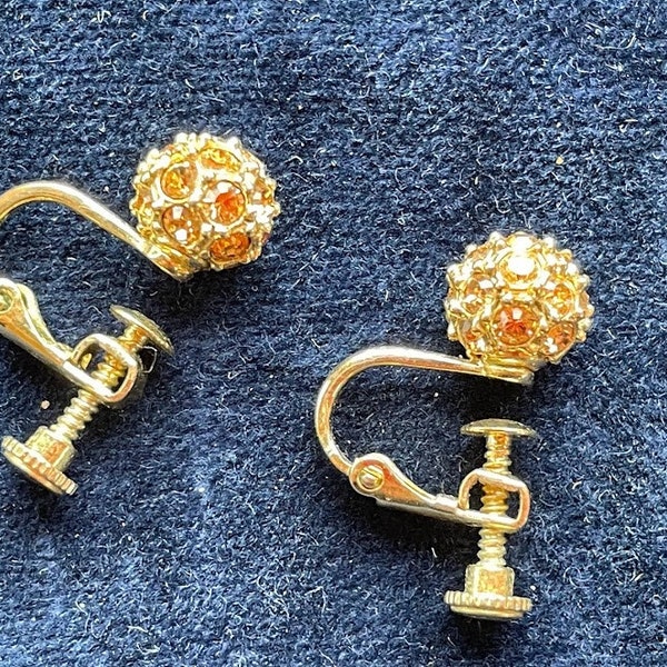 These are super cool - screw on gold (yellow metal) earing's with a bling ball of 'sparkles ta boot'