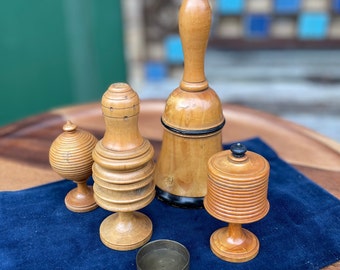 A collection of early 20th century antique turned wooden magic tricks