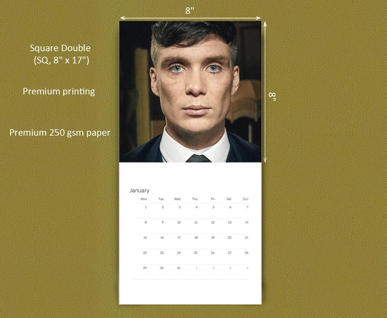May include: A wall calendar featuring a portrait of a man in a suit on the top half and a January grid on the bottom half. The calendar is labeled Square Double, 8 inches by 17 inches, premium printing, and premium 250 gsm paper.