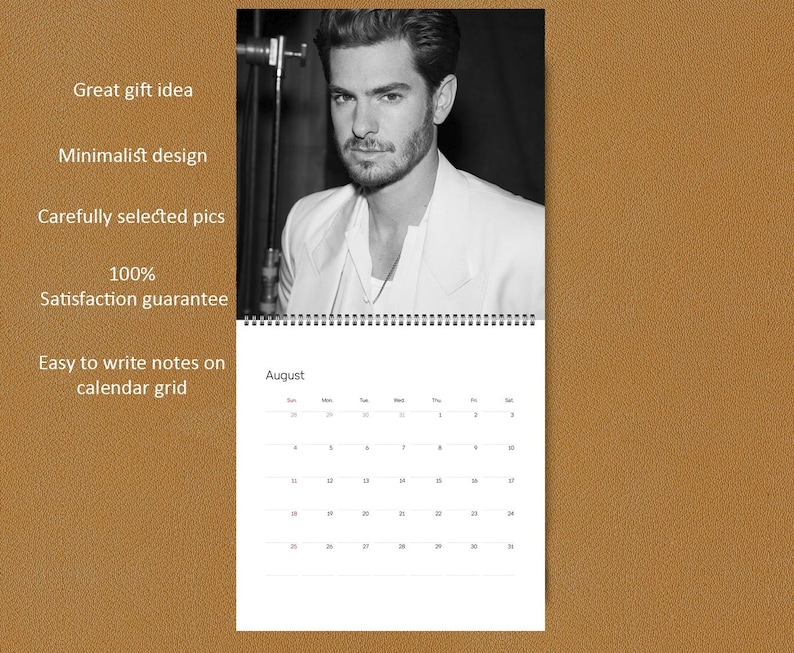May include: A wall calendar featuring a black and white portrait of a man with a beard wearing a light-colored blazer. The calendar page displays the month of August with a grid of dates. Text on the left includes Great gift idea, Minimalist design, Carefully selected pics, 100% Satisfaction guarantee, and Easy to write notes on calendar grid.