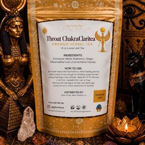 May include: A gold-colored pouch of Throat ChakraClaritea organic herbal tea, 1.4 oz loose leaf. The label lists ingredients including echinacea, nettle, elderberry, ginger, marshmallow root, licorice blend, and hyssop, with instructions and caffeine-free text.