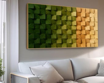 May include: A rectangular wooden wall art piece with a gradient design. The artwork features a pattern of small, square blocks that transition from dark green to light green and then to a natural wood tone. The artwork is framed in a thin, gold-colored frame.