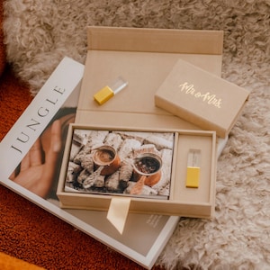 May include: A tan cardboard presentation box containing a small rectangular photo print of two copper coffee pots and a gold-coloured USB flash drive. The box lid features the gold-foiled text Mr & Mrs, and a matching gold USB drive sits nearby.