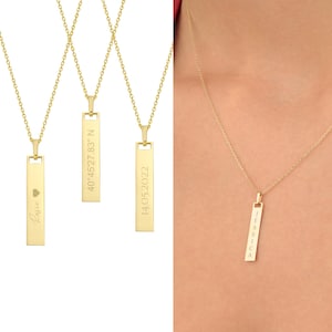 May include: Three gold necklaces with personalized bar pendants. The pendants are engraved with the names "Rosie", "14.05.2022", and "Jessica".