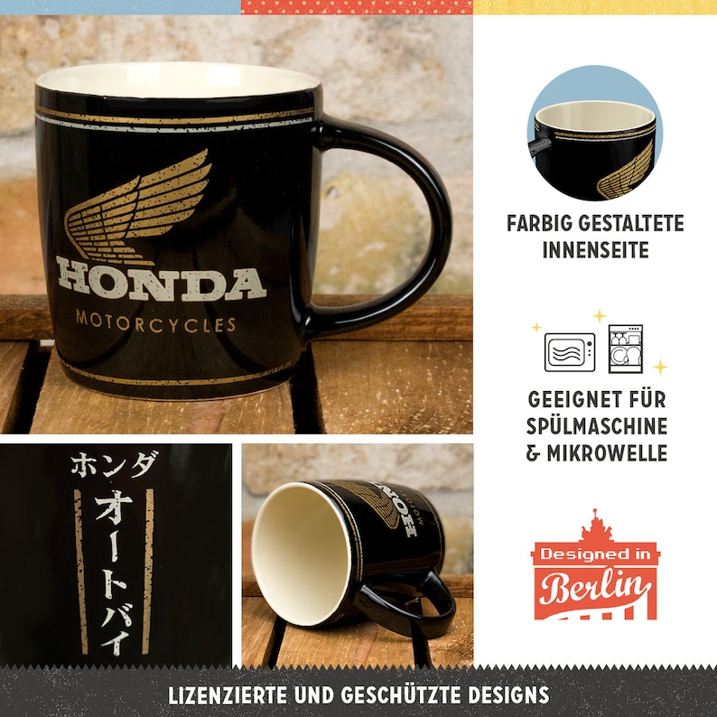 K&ouml;nnte beinhalten: Schwarze Honda Motorcycles Keramik-Tasse mit goldenem Fl&uuml;gel-Logo und Text. Die Tasse hat einen schwarzen Henkel und eine cremefarbene Innenseite. Der Text "HONDA MOTORCYCLES" ist wei&szlig;.