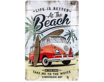 May include: A vintage-style metal sign with a red and white Volkswagen van driving on a beach with a surfboard on top. The sign has the text "Life is better at the beach" and "Take me to the waves".