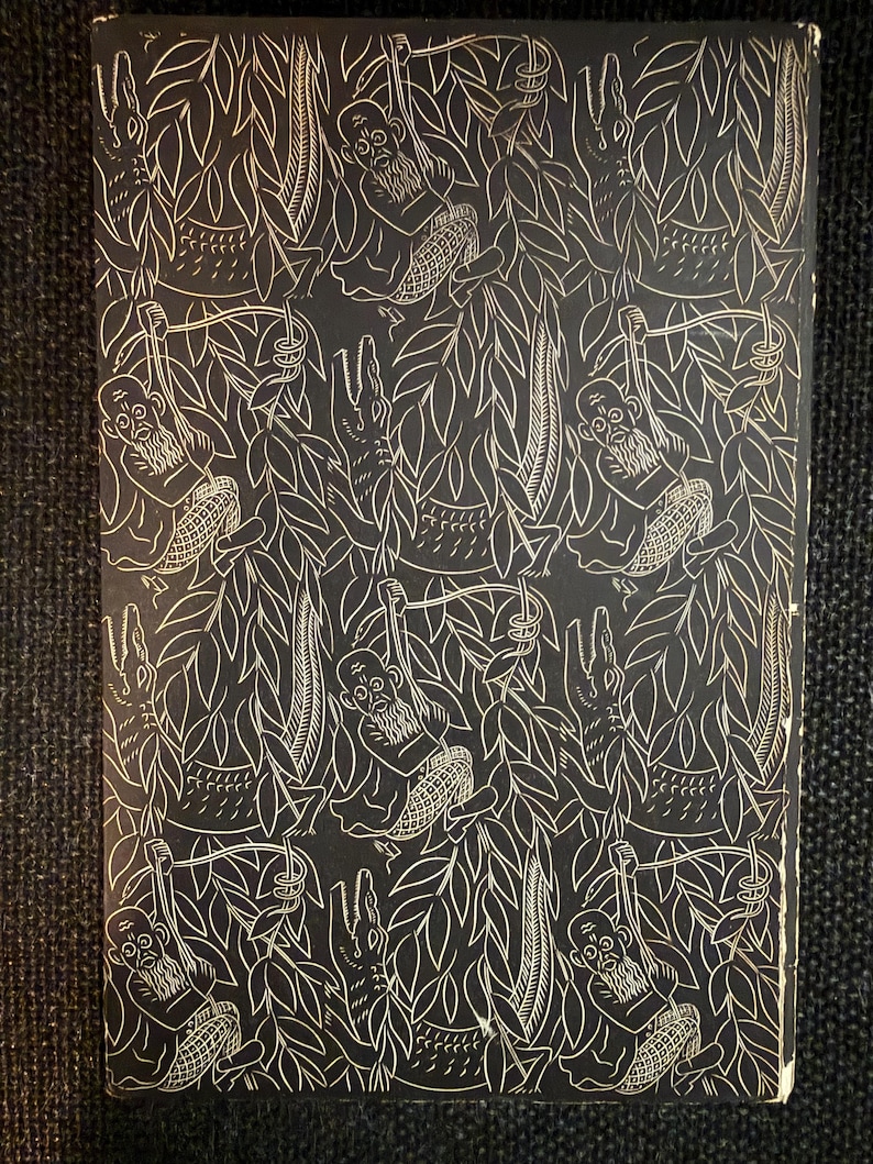 May include: A black and white illustrated book cover with a jungle theme. The design features monkeys, crocodiles, and leaves. The monkeys have long beards and are swinging from vines. The background is black, and the illustrations are white.