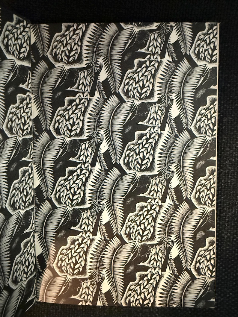 May include: Monochrome artwork with a repeating pattern of figures and foliage. The design is a detailed linocut or woodcut style, with high contrast between the black and white elements. The artwork is likely a print.