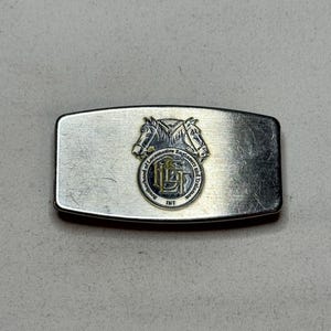 May include: Silver money clip with a gold logo featuring two horses and the text "American Locomotive Engineers and Trainmen 1811".