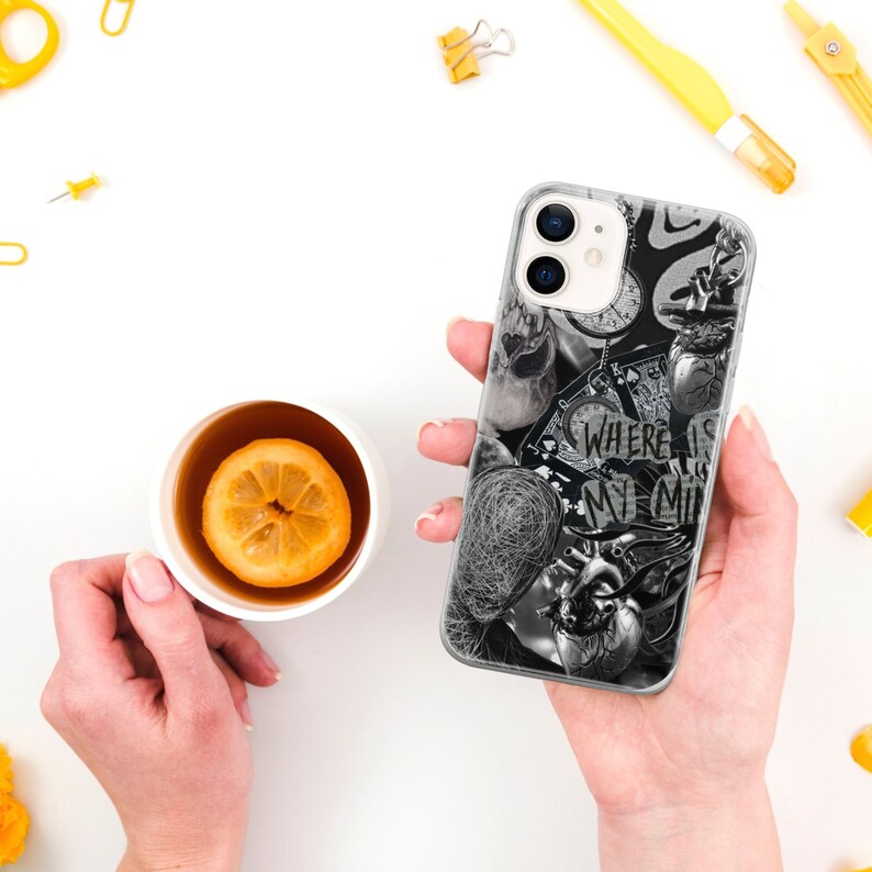 May include: A clear phone case with a black and white collage design. The design includes a heart, a clock, a compass, and the text "Where is my mind?"