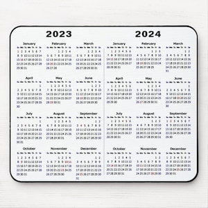 May include: A black and white calendar with blue text for the years 2023 and 2024. The calendar shows the months of the year with the days of the week labeled as Su, Mo, Tu, We, Th, Fr, Sa.