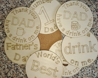 May include: A set of six round wooden coasters with laser-engraved designs. The coasters feature various messages related to Father's Day, including "Thank you Dad have a drink on me", "World's Best Dad", and "Father's Day".
