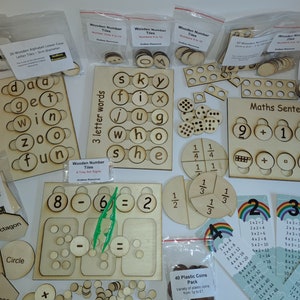 May include: A collection of wooden educational toys for children, including letter tiles, number tiles, fraction circles, and maths sentence boards. The toys are made of natural wood and have a light brown colour. There are also plastic coins and multiplication charts included.