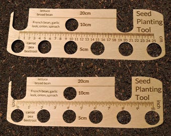 Wooden Seed Planting Tool for spacing out seeds the correct distances.