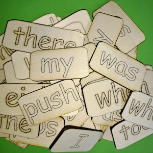 May include: A set of wooden tiles with various words written on them, including "there", "my", "was", "push", "who", "to", and "I".