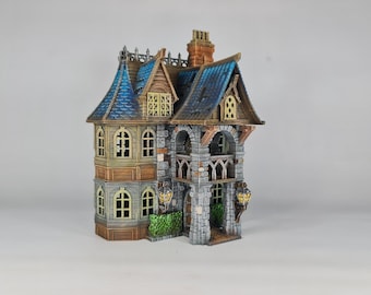 May include: A detailed miniature model of a two-story house with a blue roof, stone walls, and wooden accents. The house has multiple windows and a small porch with a railing.