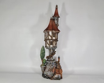 May include: A miniature model of a stone tower with a red roof and a small tree in front. The tower has a white facade with wooden beams and a small window. The base of the tower is made of stone and has a small, brown, brick building attached to it.