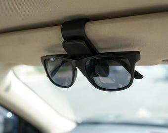 Clip de fibra de carbono para sujetar gafas de sol a la visera del coche, soporte para gafas que no daña las gafas.