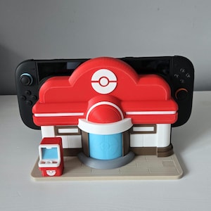 Pokopia Center Nintendo Switch 1 en 2 dockhouder – 3D-geprint gamingdockstation, switchstandaardorganizer en op Pokémon geïnspireerde display-opstelling