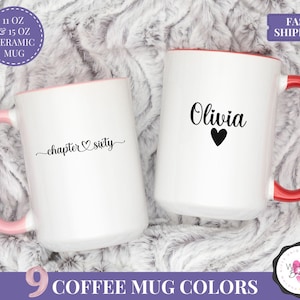 May include: Two white ceramic mugs with colored handles and interiors. One mug has "chapter sixty" in black script, the other has "Olivia" and a heart. The mugs are available in 9 colors.