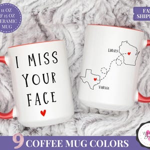 May include: Two white ceramic mugs with red handles and interiors. One mug reads "I MISS YOUR FACE" with a red heart. The other mug features state outlines with names and a dotted line. The mugs are available in 9 colors.