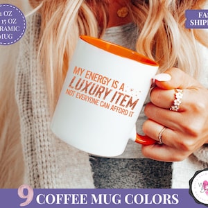 my energy is a luxury item mug ts12 mug taylor mug swifty mug tswiftie mug expensive energy self love mug coffee mug for her fan girl mug funny mug taylor fan mug gift for her orange faux glitter mug christmas mug trendy mug for women self empowerment mug comfort coffee mug pop culture fan merch gift for swifty fan high value mug showgirl mug iced coffee cup gift for taylor fan funny aesthetic mug orange mug for fans bold energy mug gift for best friend showgirl era mug