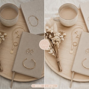 May include: A round wooden tray holding a ceramic mug of coffee, a bouquet of dried flowers, two beige notebooks, a gold chain necklace with a circular pendant, a pair of small hoop earrings, and two gold bracelets arranged on a neutral surface.