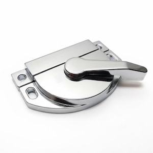 May include: A polished chrome window sash lock featuring a semi-circular base with two mounting holes on the left side and a rotating lever handle. The hardware has a reflective metallic finish and a streamlined design for securing window frames.