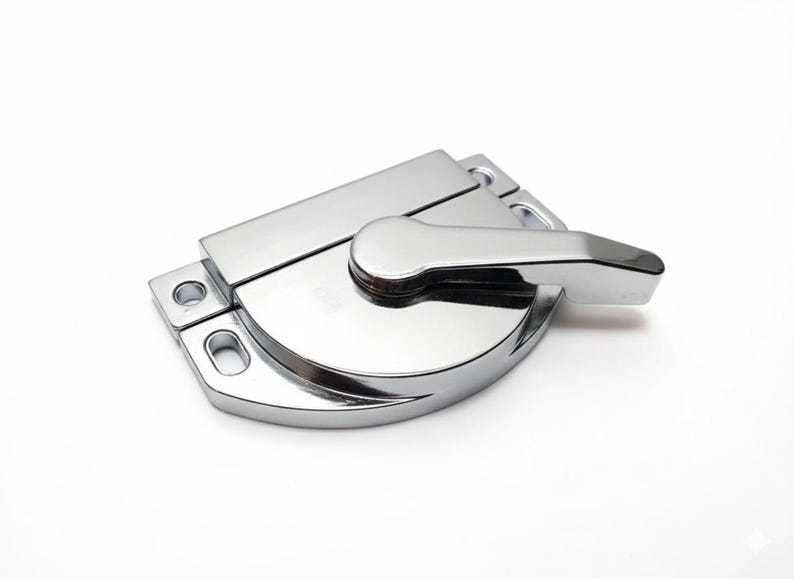 May include: A polished chrome window sash lock featuring a semi-circular base with two mounting holes on the left side and a rotating lever handle. The hardware has a reflective metallic finish and a streamlined design for securing window frames.